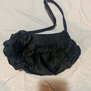 Claire’s black kid purse